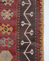 Vintage kilim rug in living room setting, old rug, antique rug, pastel colors, faded colors, Turkish rug, vintage rug, soft rug, Portland, Oregon, rug store, rug shop, local shop, earthy tones, earthy colors, warm colors