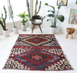 Vintage kilim rug in living room setting, bright colors, wild shaman, soft rug, bold color, Portland, Oregon, rug store, rug shop, local shop, vintage rug, modern kilim, warm colors, antique kilim rug