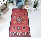 Vintage kilim rug in living room setting, old rug, antique rug, pastel colors, faded colors, Turkish rug, vintage rug, soft rug, Portland, Oregon, rug store, rug shop, local shop, earthy tones, earthy colors, warm colors