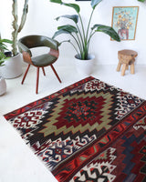 Vintage kilim rug in living room setting, bright colors, wild shaman, soft rug, bold color, Portland, Oregon, rug store, rug shop, local shop, vintage rug, modern kilim, warm colors, antique kilim rug