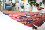 Vintage kilim rug in living room setting, old rug, antique rug, pastel colors, faded colors, Turkish rug, vintage rug, soft rug, Portland, Oregon, rug store, rug shop, local shop, earthy tones, earthy colors, warm colors