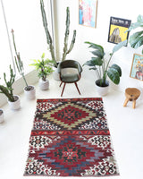 Vintage kilim rug in living room setting, bright colors, wild shaman, soft rug, bold color, Portland, Oregon, rug store, rug shop, local shop, vintage rug, modern kilim, warm colors, antique kilim rug