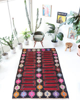 Vintage kilim rug in living room setting, bright colors, wild shaman, soft rug, bold color, Portland, Oregon, rug store, rug shop, local shop, vintage rug, modern kilim, warm colors, antique kilim rug