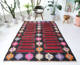 Vintage kilim rug in living room setting, bright colors, wild shaman, soft rug, bold color, Portland, Oregon, rug store, rug shop, local shop, vintage rug, modern kilim, warm colors, antique kilim rug