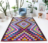 Vintage kilim rug in living room setting, bright colors, wild shaman, soft rug, bold color, Portland, Oregon, rug store, rug shop, local shop, vintage rug, modern kilim, warm colors, antique kilim rug