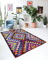 Vintage kilim rug in living room setting, bright colors, wild shaman, soft rug, bold color, Portland, Oregon, rug store, rug shop, local shop, vintage rug, modern kilim, warm colors, antique kilim rug