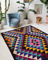 Vintage kilim rug in living room setting, bright colors, wild shaman, soft rug, bold color, Portland, Oregon, rug store, rug shop, local shop, vintage rug, modern kilim, warm colors, antique kilim rug