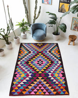 Vintage kilim rug in living room setting, bright colors, wild shaman, soft rug, bold color, Portland, Oregon, rug store, rug shop, local shop, vintage rug, modern kilim, warm colors, antique kilim rug