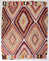 Vintage kilim rug in room decor setting, old rug, antique rug, pastel colors, faded colors, Turkish rug, vintage rug, soft rug, Portland, Oregon, rug store, rug shop, local shop, antique kilim rug, bold colors, bright colors, faded colors