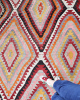 Vintage kilim rug in room decor setting, old rug, antique rug, pastel colors, faded colors, Turkish rug, vintage rug, soft rug, Portland, Oregon, rug store, rug shop, local shop, antique kilim rug, bold colors, bright colors, faded colors