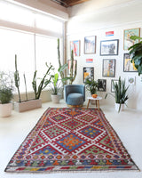 Vintage kilim rug in living room setting, bright colors, wild shaman, soft rug, bold color, Portland, Oregon, rug store, rug shop, local shop, vintage rug, modern kilim, warm colors