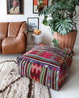 Floor pouf in a living room setting, pillow, turkish pillow, kilim pillow, home decor, decorative pillow, sham, rug pillow, decor, home decor, pouf, floor cushion, cushion, Portland, rugshop, Oregon, Wild Shaman, ottoman