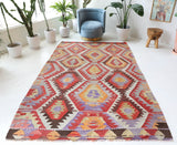 Vintage kilim rug in room decor setting, old rug, antique rug, pastel colors, faded colors, Turkish rug, vintage rug, soft rug, Portland, Oregon, rug store, rug shop, local shop, antique kilim rug, bold colors, bright colors, faded colors