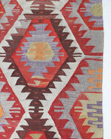 Vintage kilim rug in room decor setting, old rug, antique rug, pastel colors, faded colors, Turkish rug, vintage rug, soft rug, Portland, Oregon, rug store, rug shop, local shop, antique kilim rug, bold colors, bright colors, faded colors