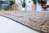 Vintage kilim rug in living room setting, old rug, antique rug, pastel colors, faded colors, Turkish rug, vintage rug, soft rug, Portland, Oregon, rug store, rug shop, local shop, earthy tones, earthy colors, warm colors