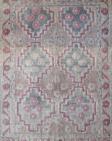 Vintage kilim rug in living room setting, old rug, antique rug, pastel colors, faded colors, Turkish rug, vintage rug, soft rug, Portland, Oregon, rug store, rug shop, local shop, earthy tones, earthy colors, warm colors