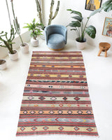 Vintage kilim rug in room decor setting, old rug, antique rug, pastel colors, faded colors, Turkish rug, vintage rug, soft rug, Portland, Oregon, rug store, rug shop, local shop, antique kilim rug, bold colors, bright colors, faded colors