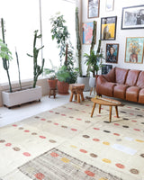 Vintage kilim rug in living room setting, old rug, antique rug, pastel colors, faded colors, Turkish rug, vintage rug, soft rug, Portland, Oregon, rug store, rug shop, local shop, earthy tones, earthy colors, warm colors