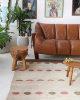 Vintage kilim rug in living room setting, old rug, antique rug, pastel colors, faded colors, Turkish rug, vintage rug, soft rug, Portland, Oregon, rug store, rug shop, local shop, earthy tones, earthy colors, warm colors