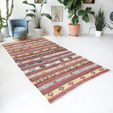 Vintage kilim rug in room decor setting, old rug, antique rug, pastel colors, faded colors, Turkish rug, vintage rug, soft rug, Portland, Oregon, rug store, rug shop, local shop, antique kilim rug, bold colors, bright colors, faded colors