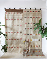 Vintage kilim rug in living room setting, old rug, antique rug, pastel colors, faded colors, Turkish rug, vintage rug, soft rug, Portland, Oregon, rug store, rug shop, local shop, earthy tones, earthy colors, warm colors