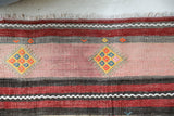 Vintage kilim rug in room decor setting, old rug, antique rug, pastel colors, faded colors, Turkish rug, vintage rug, soft rug, Portland, Oregon, rug store, rug shop, local shop, antique kilim rug, bold colors, bright colors, faded colors