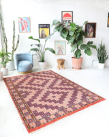 Vintage kilim rug in room decor setting, old rug, antique rug, pastel colors, faded colors, Turkish rug, vintage rug, soft rug, Portland, Oregon, rug store, rug shop, local shop, antique kilim rug, bold colors, bright colors, faded colors