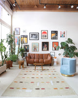 Vintage kilim rug in living room setting, old rug, antique rug, pastel colors, faded colors, Turkish rug, vintage rug, soft rug, Portland, Oregon, rug store, rug shop, local shop, earthy tones, earthy colors, warm colors