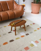 Vintage kilim rug in living room setting, old rug, antique rug, pastel colors, faded colors, Turkish rug, vintage rug, soft rug, Portland, Oregon, rug store, rug shop, local shop, earthy tones, earthy colors, warm colors