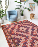 Vintage kilim rug in room decor setting, old rug, antique rug, pastel colors, faded colors, Turkish rug, vintage rug, soft rug, Portland, Oregon, rug store, rug shop, local shop, antique kilim rug, bold colors, bright colors, faded colors