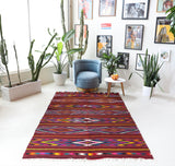 Vintage kilim rug in living room setting, bright colors, wild shaman, soft rug, bold color, Portland, Oregon, rug store, rug shop, local shop, vintage rug, modern kilim, warm colors