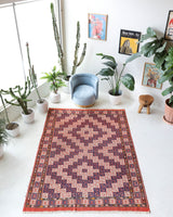 Vintage kilim rug in room decor setting, old rug, antique rug, pastel colors, faded colors, Turkish rug, vintage rug, soft rug, Portland, Oregon, rug store, rug shop, local shop, antique kilim rug, bold colors, bright colors, faded colors