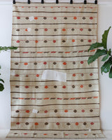 Vintage kilim rug in living room setting, old rug, antique rug, pastel colors, faded colors, Turkish rug, vintage rug, soft rug, Portland, Oregon, rug store, rug shop, local shop, earthy tones, earthy colors, warm colors