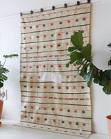 Vintage kilim rug in living room setting, old rug, antique rug, pastel colors, faded colors, Turkish rug, vintage rug, soft rug, Portland, Oregon, rug store, rug shop, local shop, earthy tones, earthy colors, warm colors