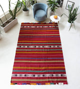 Vintage kilim rug in living room setting, bright colors, wild shaman, soft rug, bold color, Portland, Oregon, rug store, rug shop, local shop, vintage rug, modern kilim, warm colors