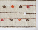 Vintage kilim rug in living room setting, old rug, antique rug, pastel colors, faded colors, Turkish rug, vintage rug, soft rug, Portland, Oregon, rug store, rug shop, local shop, earthy tones, earthy colors, warm colors