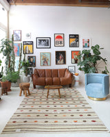 Vintage kilim rug in living room setting, old rug, antique rug, pastel colors, faded colors, Turkish rug, vintage rug, soft rug, Portland, Oregon, rug store, rug shop, local shop, earthy tones, earthy colors, warm colors