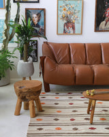 Vintage kilim rug in living room setting, old rug, antique rug, pastel colors, faded colors, Turkish rug, vintage rug, soft rug, Portland, Oregon, rug store, rug shop, local shop, earthy tones, earthy colors, warm colors