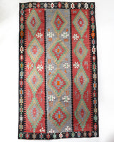 Vintage kilim rug in living room setting, bright colors, wild shaman, soft rug, bold color, Portland, Oregon, rug store, rug shop, local shop, vintage rug, modern kilim, warm colors