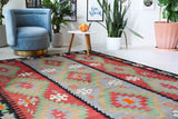 Vintage kilim rug in living room setting, bright colors, wild shaman, soft rug, bold color, Portland, Oregon, rug store, rug shop, local shop, vintage rug, modern kilim, warm colors