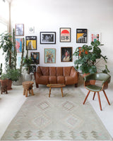Vintage kilim rug in living room setting, old rug, antique rug, pastel colors, faded colors, Turkish rug, vintage rug, soft rug, Portland, Oregon, rug store, rug shop, local shop, earthy tones, earthy colors, warm colors