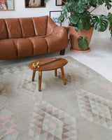 Vintage kilim rug in living room setting, old rug, antique rug, pastel colors, faded colors, Turkish rug, vintage rug, soft rug, Portland, Oregon, rug store, rug shop, local shop, earthy tones, earthy colors, warm colors