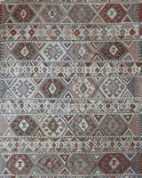 Vintage kilim rug in living room setting, old rug, antique rug, pastel colors, faded colors, Turkish rug, vintage rug, soft rug, Portland, Oregon, rug store, rug shop, local shop, earthy tones, earthy colors, warm colors