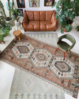 Vintage kilim rug in living room setting, old rug, antique rug, pastel colors, faded colors, Turkish rug, vintage rug, soft rug, Portland, Oregon, rug store, rug shop, local shop, earthy tones, earthy colors, warm colors