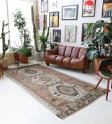 Vintage kilim rug in living room setting, old rug, antique rug, pastel colors, faded colors, Turkish rug, vintage rug, soft rug, Portland, Oregon, rug store, rug shop, local shop, earthy tones, earthy colors, warm colors