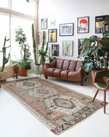 vVintage kilim rug in living room setting, old rug, antique rug, pastel colors, faded colors, Turkish rug, vintage rug, soft rug, Portland, Oregon, rug store, rug shop, local shop, earthy tones, earthy colors, warm colors