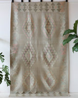 Vintage kilim rug in living room setting, old rug, antique rug, pastel colors, faded colors, Turkish rug, vintage rug, soft rug, Portland, Oregon, rug store, rug shop, local shop, earthy tones, earthy colors, warm colors