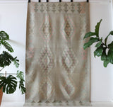 Vintage kilim rug in living room setting, old rug, antique rug, pastel colors, faded colors, Turkish rug, vintage rug, soft rug, Portland, Oregon, rug store, rug shop, local shop, earthy tones, earthy colors, warm colors