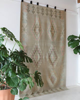 Vintage kilim rug in living room setting, old rug, antique rug, pastel colors, faded colors, Turkish rug, vintage rug, soft rug, Portland, Oregon, rug store, rug shop, local shop, earthy tones, earthy colors, warm colors