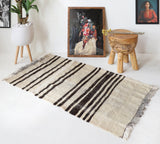 Vintage kilim rug in room decor setting, old rug, antique rug, pastel colors, faded colors, Turkish rug, vintage rug, soft rug, Portland, Oregon, rug store, rug shop, local shop, antique rug